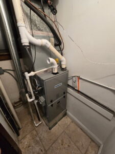A furnace unit with new piping and condensate lines installed by HVAC Royal Service Inc in Chicago, IL.