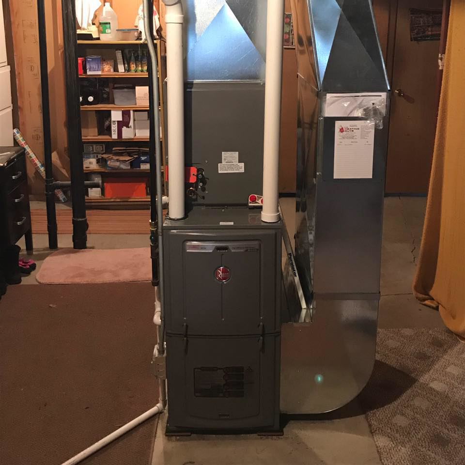 A newly installed furnace and ductwork in a basement by The Heating Guys in Fargo, ND.
