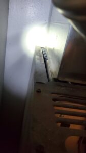 A close-up view of the interior components during a furnace inspection by Hicken Air in Gilbert, AZ