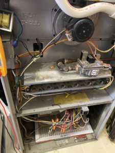Internal components of a furnace or air handler being serviced by Fox Heating and Air service in Hueytown, AL.