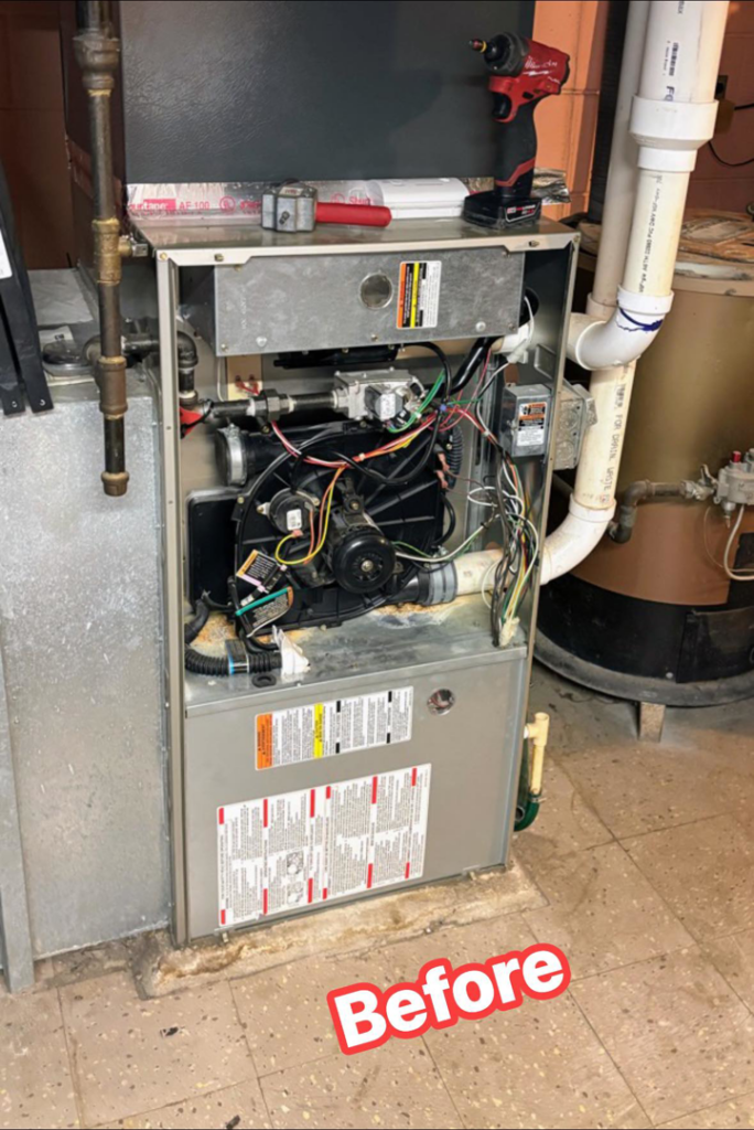 A furnace with its internal components exposed before repair by Polar Air Heating and Cooling in Omaha, NE