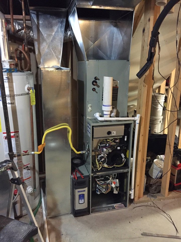 Internal components of a furnace being repaired or serviced by Any Climate Mechanical HVAC in Sandy, UT.