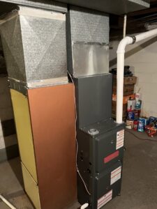 A new furnace replacement installation next to an older unit by I & M Heating and Cooling in South Bend, IN.