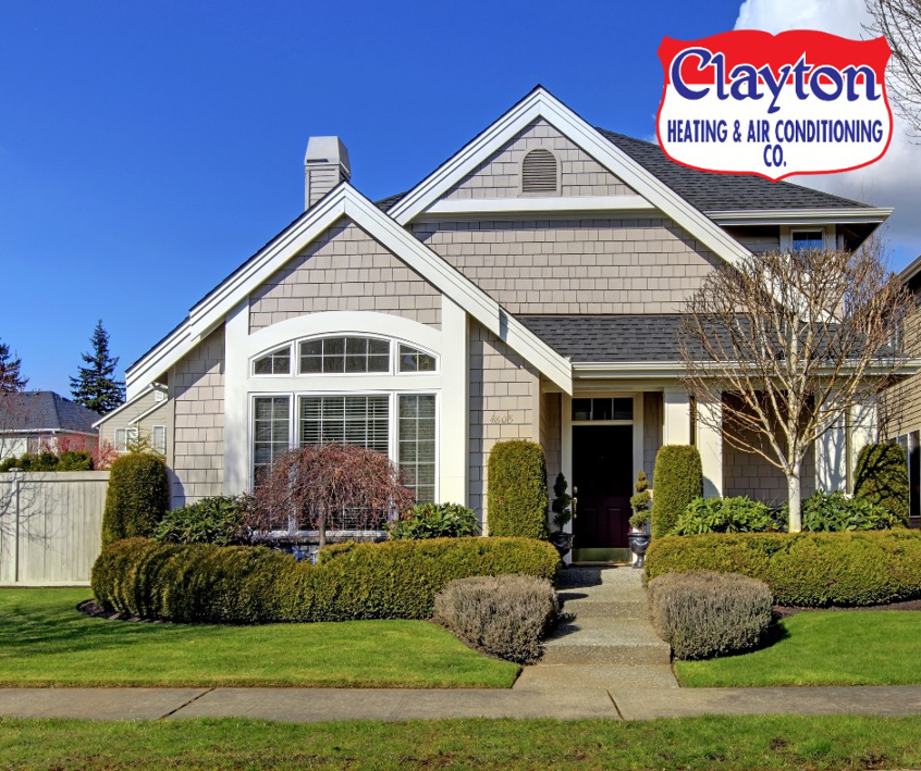 A furnace and water heater installed in a basement by Clayton Heating & Air Conditioning Co. in Youngstown, OH.