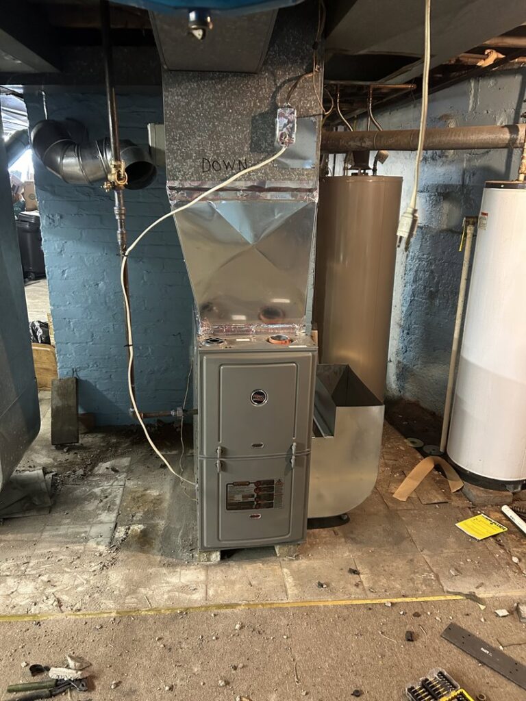 A furnace and water heater installation in a basement by Climate Diagnostics in Buffalo, NY.
