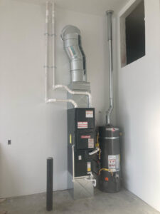 A new Goodman furnace and water heater installation with ductwork by AP HVAC in Ridgewood, NY.