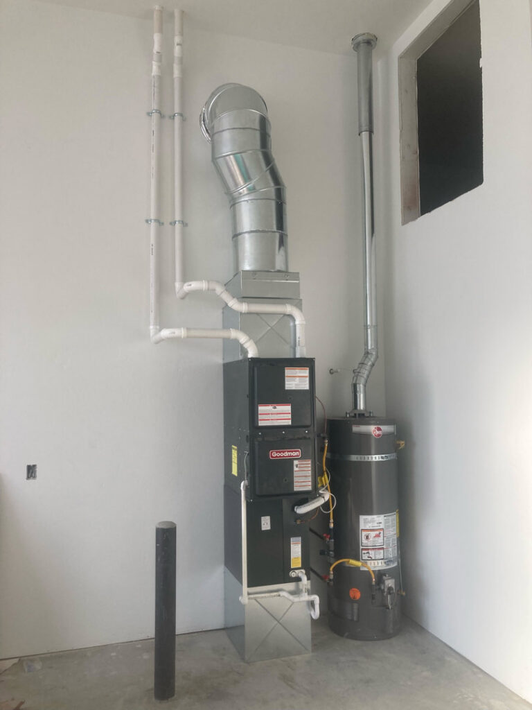 A new Goodman furnace and water heater installation with ductwork by AP HVAC in Ridgewood, NY.