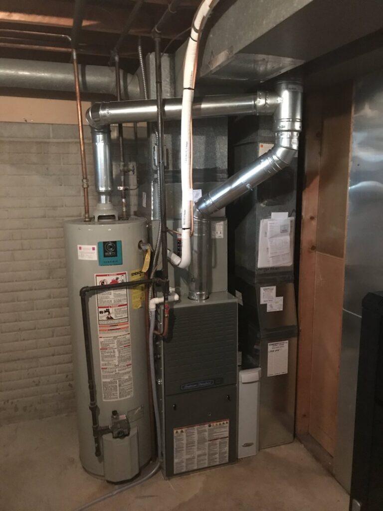 A new furnace and water heater installation in a basement by Comforttechs in Lincoln, NE.