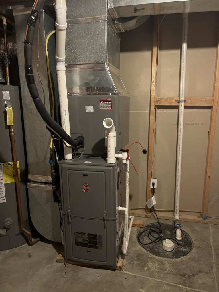 A new furnace and water heater system installation with visible piping and ductwork by Force Mechanical Services in Churchville, MD.