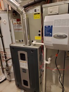 A furnace system with an Aprilaire 700 humidifier, installed or serviced by Service Pro Titans in Chicago, IL.