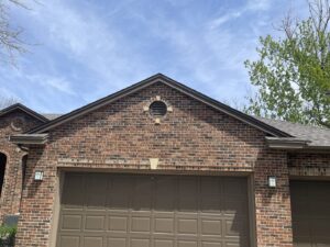 A gable vent on a brick house, a potential wildlife entry point addressed by Prairie Bat Services, LLC in Sioux Falls, SD.