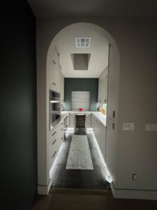 Galley kitchen with stylish under-cabinet and recessed lighting installed by Sparks By Rabbit LLC in Scottsdale, AZ.