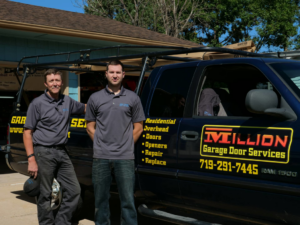 Two Million Garage Door Services contractors standing proudly with their branded service truck in Colorado Springs, CO.