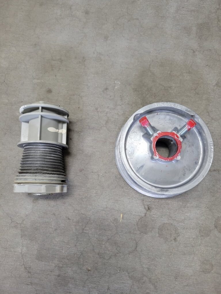 Garage door drum and pulley parts laid out for repair or replacement by Gryffin Garage Door in Chandler, AZ