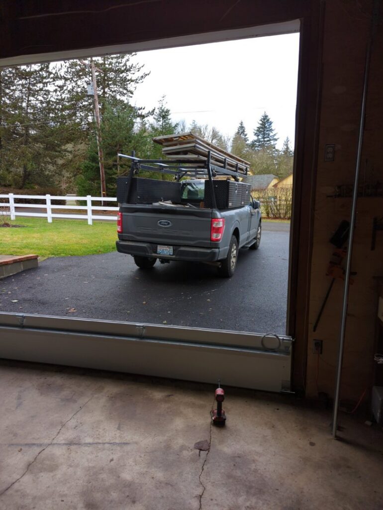 View from inside a garage during a garage door installation or repair by Babcock Garage Doors in Vancouver, WA