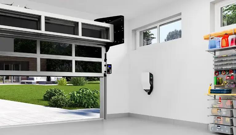 An interior view of a garage with a modern door partially open, showcasing the installation by Dylan's Garage Doors & Service in Columbia, MO.