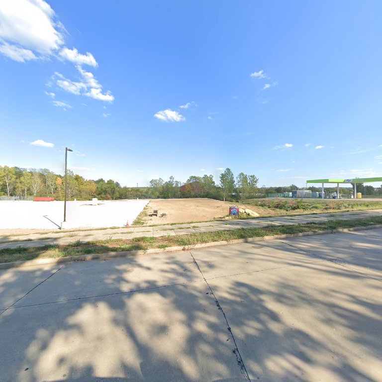 A garage door opener and chain mechanism installed, demonstrating the work of Overhead Door Company of Central Missouri in Columbia, MO.