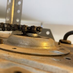 A close-up view of a garage door opener's chain drive mechanism, maintained by MGG Garage Door Service in San Tan Valley, AZ