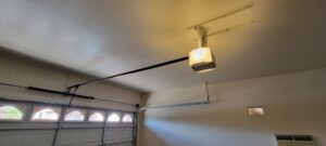 A newly installed garage door opener and track system by Team Garage Doors in Mesa, AZ.