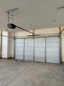 Interior view of a newly installed garage door and opener system by Sonoran Garage Doors in Mesa, AZ