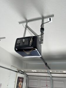 A close-up view of a garage door opener motor professionally installed by Morning Star Garage Doors in Phoenix, AZ.