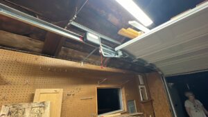 A garage door opener system installed or repaired inside a residential garage by Rhino Garage Doors LLC OKC in Edmond, OK.