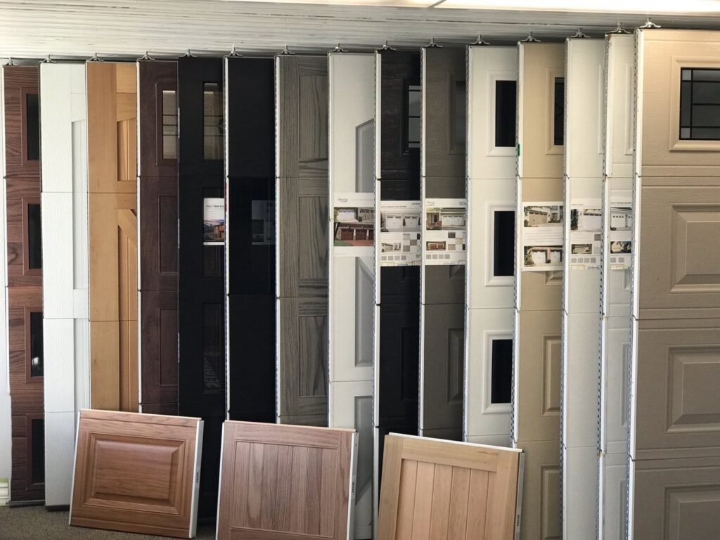 A showroom display of various garage door panels and styles at SCI Door in Yakima, WA