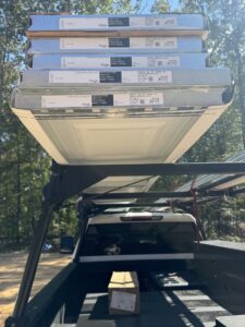 New garage door panels loaded on a truck, ready for installation by Specialty Garage Door in Bossier City, LA