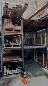 An organized storage area with various garage door parts and components for Greeley garage door repair in Greeley, CO.