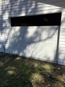 A garage door replacement in progress on a residential home by Lenny's Garage Door in Louisville, KY.