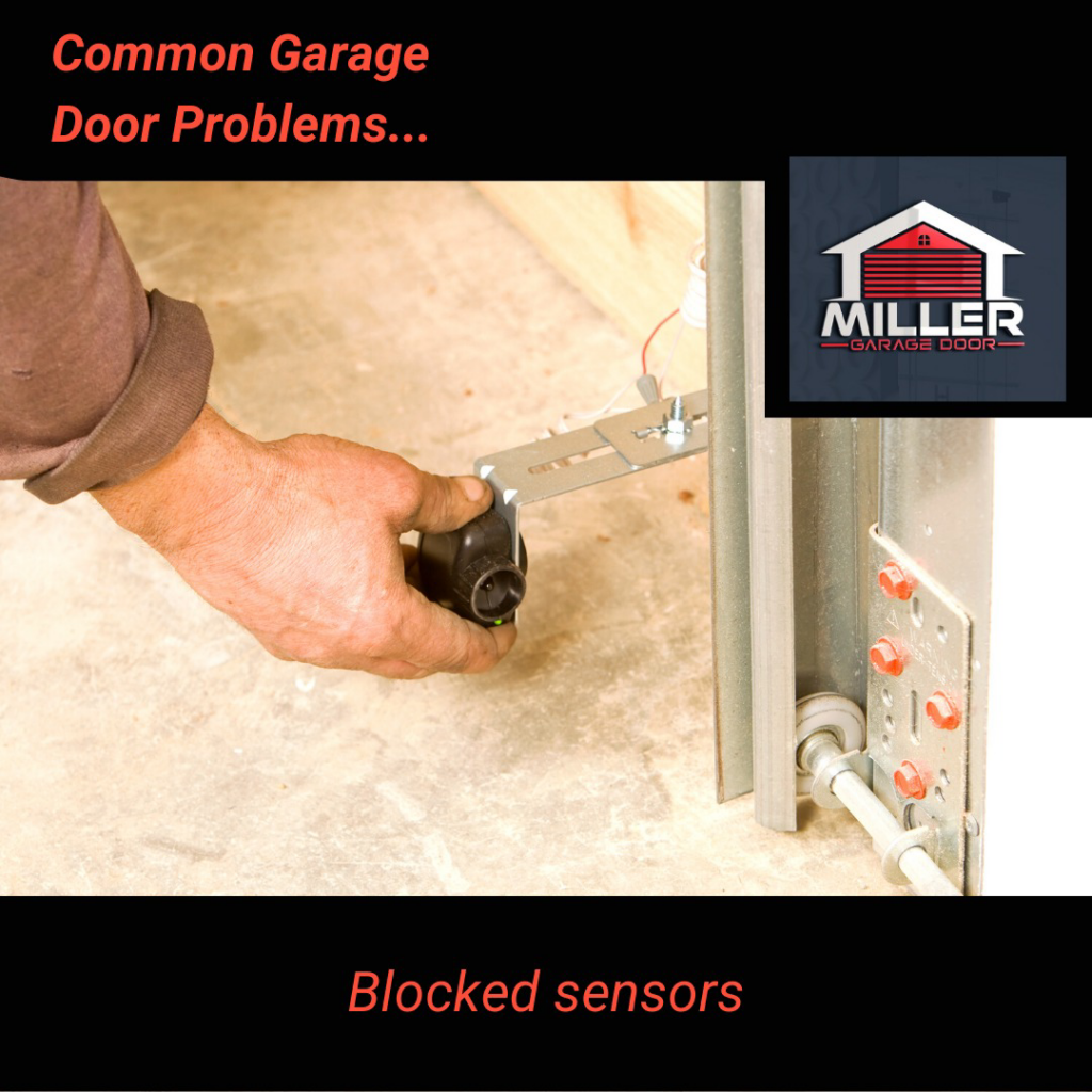 A technician's hand adjusting a garage door safety sensor for Miller Garage Door in Princeton, NJ