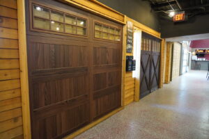 An interior view of the garage door showroom displaying various models at Garage Doors Of Indianapolis in Indianapolis, IN