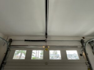 A close-up of a garage door spring and track mechanism, expertly serviced by Rainier Garage Door in Bellevue, WA.