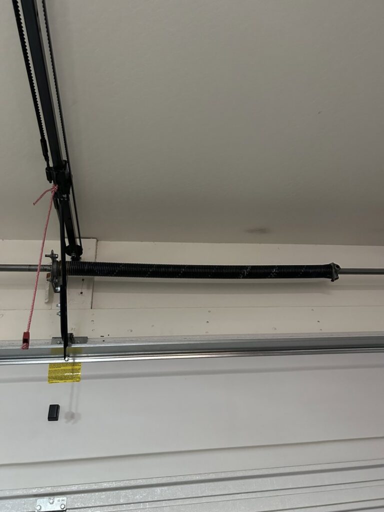 A newly installed or repaired garage door torsion spring by 4 Sons Garage Door in Phoenix, AZ.