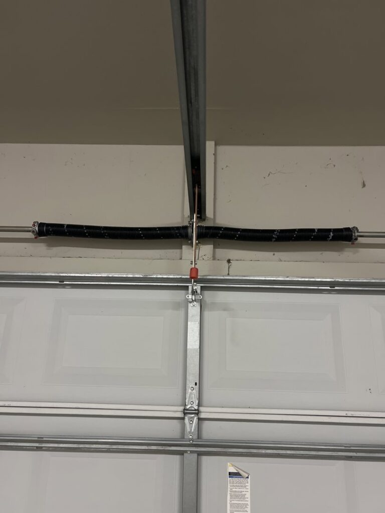 Close-up of a garage door torsion spring system installation by Specialty Garage Door in Bossier City, LA