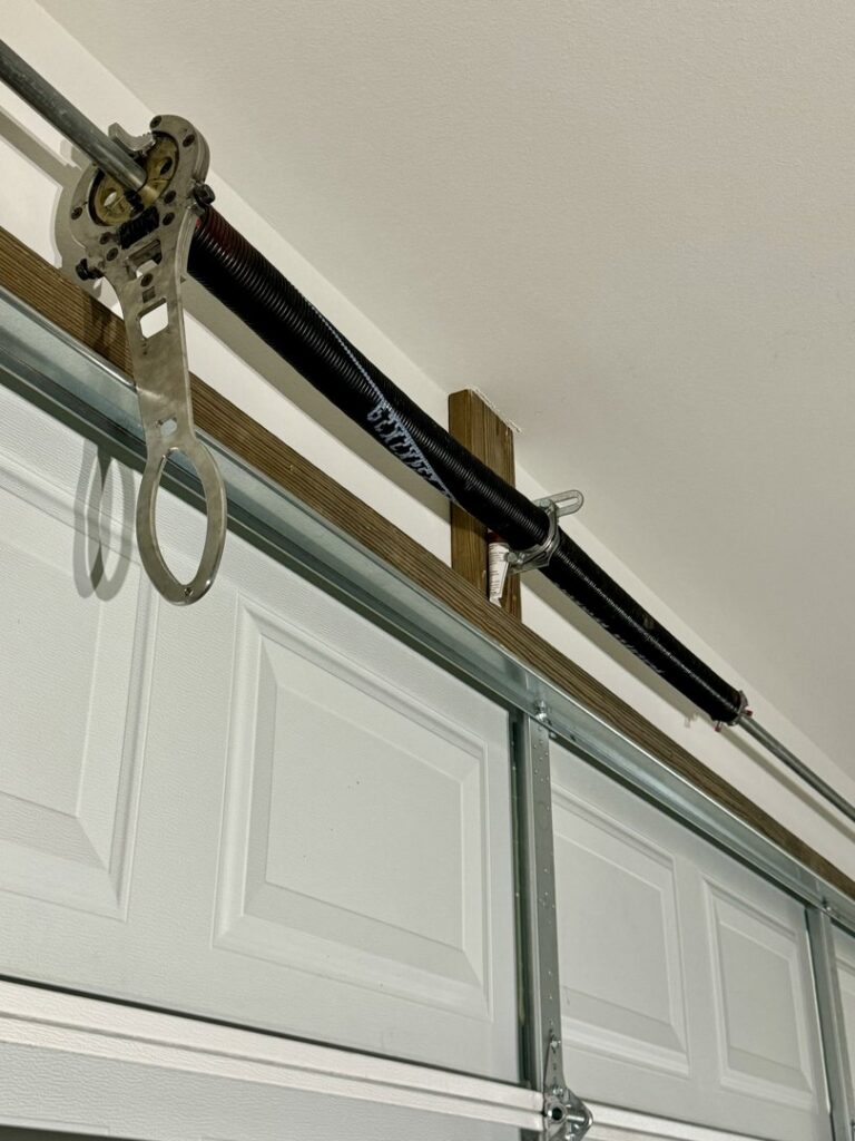 Close-up of a garage door torsion spring system serviced by Specialty Garage Door in Bossier City, LA