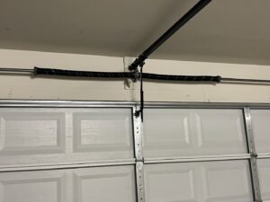 A close-up view of a garage door torsion spring system, a common repair for Tucson Garage Door Doc in Tucson, AZ.