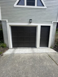 Various garage door torsion springs and hardware components laid out, ready for use by CHS Garage Repair of Seattle, WA.