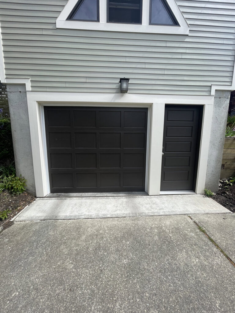 Various garage door torsion springs and hardware components laid out, ready for use by CHS Garage Repair of Seattle, WA.
