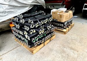 Pallets stacked with new garage door torsion springs, ready for service by Lion Heart Garage Doors in Thornton, CO.