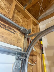 A garage door track and torsion spring assembly being installed or repaired by Colorado Garage Door Guy in Aurora, CO.