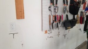Newly installed electrical outlets and switches on a garage wall, completed by Molitor Electric in Austin, TX.