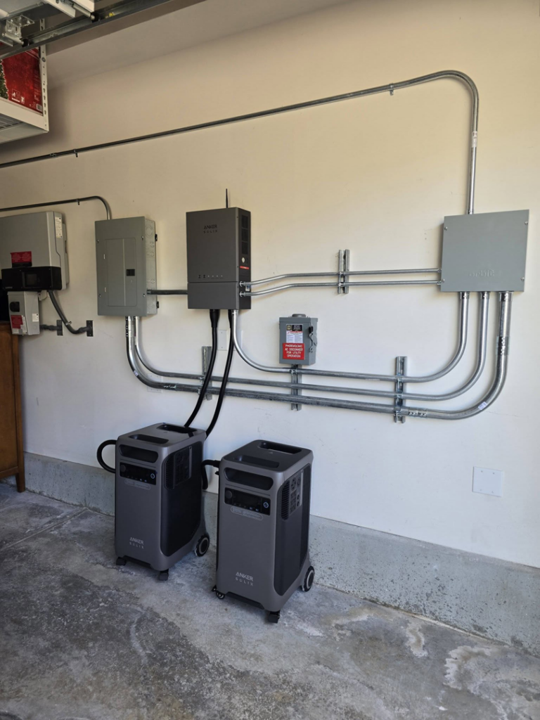 An indoor garage electrical panel and conduit installation with power stations by Ride the Lightning Electrical Services in El Cajon, CA.