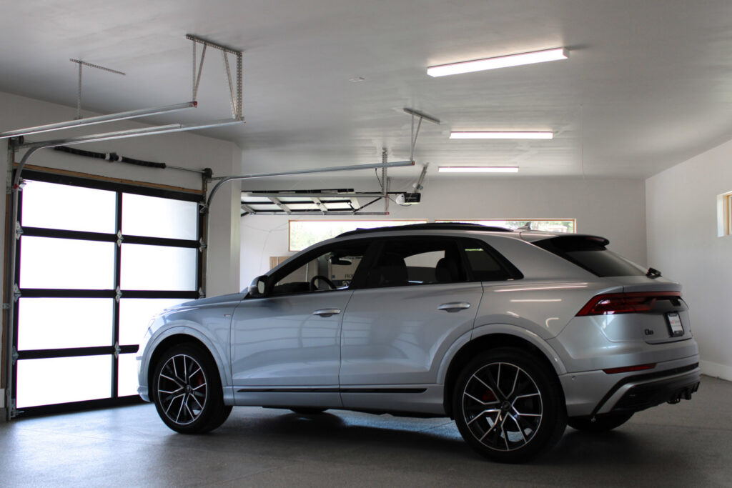 Bright fluorescent lighting installed in a modern garage by ACJ Electric LLC in North Babylon, NY.