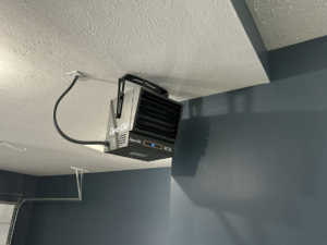 An electric garage heater professionally installed on a ceiling by Heritage Electric LLC in Indianapolis, IN.