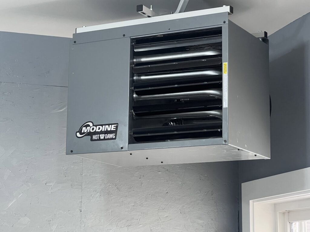 A Modine Hot Dawg garage heater installed on a ceiling by A&E Heating & Cooling in Fort Worth, TX.