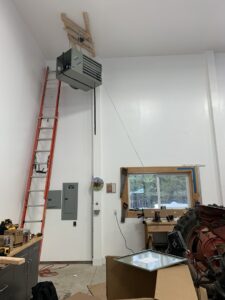 A large ceiling-mounted garage heater installation by Finney Heating and Cooling LLC in Post Falls, ID.