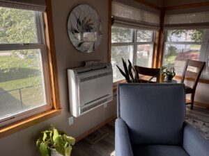 A garage heater being lifted into position for installation by TruLine HVAC in Cedar Rapids, IA.