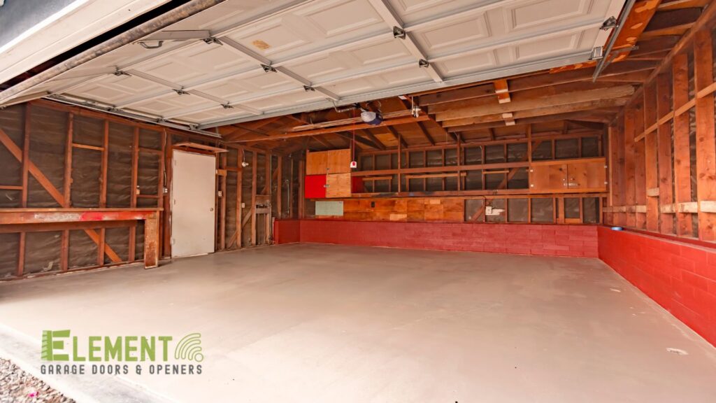 View inside a clean garage with the door open, highlighting the overhead system by Element Garage Door Repair Of Portland, OR