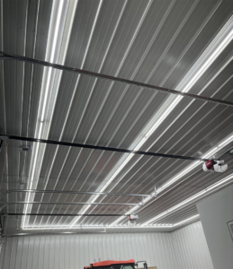 Bright LED strip lighting installed on the ceiling of a garage by Blevens Electric LLC in Bowling Green, KY